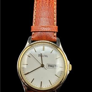 Bulova Two-Tone Gold Bezel Watch with White Dial and Brown Strap. New old stock